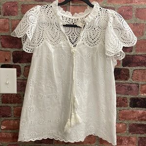 Cute eyelet top.